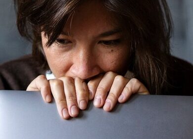 front-view-woman-holding-laptop_52683-97687